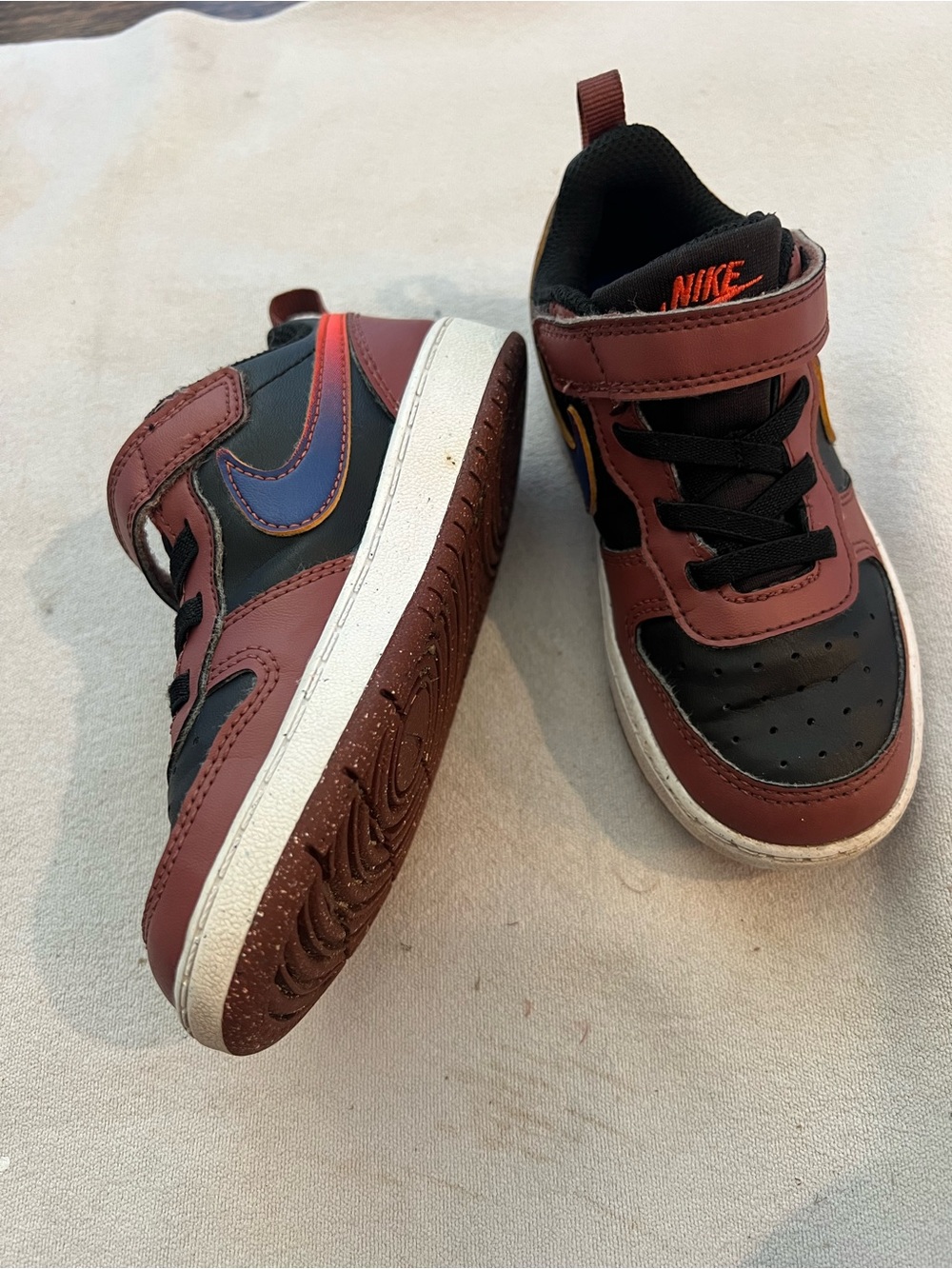 Nike Toddler Brow & Black Hook-and-Loop Sneakers with blue & orange Swoosh; 9c